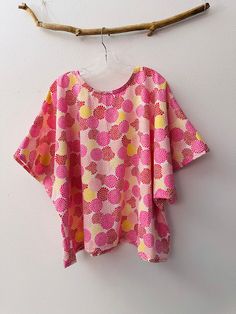 ready wear Japanese pink chrysanthemum pattern cotton kimono top  top length 26" top width 60" material:  ready wear Japanese pink chrysanthemum pattern cotton kimono top  chrysanthemom light weight dobby cotton Fabric is with nice feel and light weight design:  wide sleeve kimono top with short to elbow length sleeve measurements of this ready wear top: top length 26" top width 60" kimono sleeve length from neckline to hem is about 16"-17" This is a ready wear item. Long Sleeve Pink Cotton Kimono, Long Sleeve Pink Printed Kimono, Embroidered One-size Summer Kimono, Japanese Pink, Printed Cotton V-neck Kimono, Chrysanthemum Kimono, Sewing Designs, Cotton Kimono, Linen Clothing