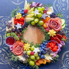 a wreath made out of fruits and vegetables