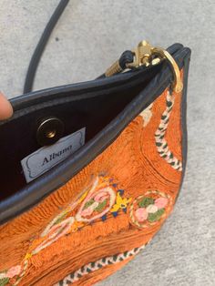 "Make this fabulous embroidered black leather crossbody yours. 100% Genuine Leather Beautiful embroidery Height with strap at longest: 32\" Height without strap: 8.75\" Width: 9.5\"" Embroidered Leather Evening Bag, Multicolor Embroidered Crossbody Shoulder Bag With Adjustable Strap, Multicolor Embroidery Crossbody Shoulder Bag, Festival Embroidered Leather Shoulder Bag, Vintage Embroidered Leather Bags, Vintage Crossbody Bag, Acid Wash Denim, Black Tunic, Beautiful Embroidery