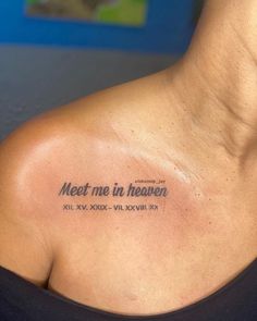 a woman with a tattoo on her shoulder that says meet me in heaven, all xxxl xxl xxl