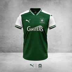 a green and white soccer jersey with the word ginsters on it's chest