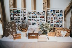 the table is set up with photos and other items for wedding guests to take home