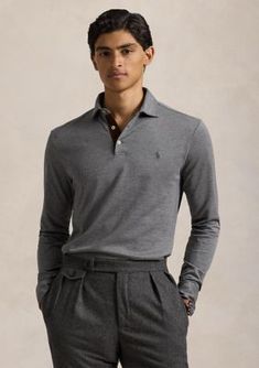 Tailored in a slim fit, this long-sleeved polo features a herringbone design for an elevated finish. Custom Slim Fit: a trim silhouette in between Polo's Classic Fit and Slim Fit Tailored through the waist Size medium has a 28.5 body length (front and back), an 18 shoulder, a 43 chest, and a 34.5 sleeve length Sleeve length is taken from the center back of the neck and changes 1 between sizes Medium-spread Polo collar Three-button placket Faux-suede trim at the placket facing Long sleeves with buttoned barrel cuffs Even vented hem Signature embroidered Pony at the left chest Model is 6'1" (185 cm) and wears a size medium By choosing Ralph Lauren's cotton products, you're supporting investment in the Better Cotton mission to help cotton communities survive and thrive while protecting and re Fitted Long Sleeve Polo Shirt For Formal Occasions, Long Sleeve Polo Shirt For Workwear, Classic Fitted Long Sleeve Polo Shirt, Herringbone Design, Polo Classic, Polo Collar, Polo Ralph Lauren Mens, Button Placket, Waist Size