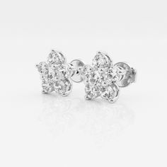 Feminine and dainty, these flower shaped studs are your perfect everyday pair. Wear it as your main pair of earrings or stack them with hoops to have some fun. Classic White Flower Shape Cluster Earrings, Classic White Flower-shaped Cluster Earrings, Classic Diamond Flower Earrings, Classic Diamond Flower-shaped Earrings, Classic Brilliant Cut Flower Earrings, Classic Diamond White Flower Earrings, Classic Flower-shaped Brilliant Cut Earrings, Classic Flower Earrings With Brilliant Cut, Classic White Flower Earrings With Prong Setting