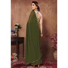 Green colored saree is made from georgette fabric which is highlighted with weaving checks & lace border work as shown with pleats are stitched and size adjusted belt. comes along with printed banglori silk blouse which you can customise as per your design/style. Occasion - You can wear this saree for parties, functions and events. Note:- the actual product may differ slightly in color and design from the one illustrated in the images when compared with computer or mobile screen. Measurements: S Green Georgette Dupatta With Printed Border, Festive Georgette Pre-draped Saree With Border, Green Chiffon Saree With Dupatta, Traditional Green Chiffon Saree, Festive Green Chiffon Saree, Designer Pre-draped Georgette Saree With Printed Border, Georgette Dupatta With Border, Green Pre-draped Saree With Border, Traditional Pre-draped Georgette Saree With Border