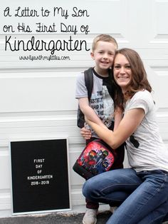 a mother and son hugging each other in front of a white garage door with the words, a letter to my son on the first day of kindergarten