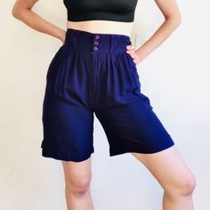 "80's Vintage purple ultra high waisted front pleated cargo shorts by GITANO . Wide belt loops. 3 button and zipper fly. Cuffed hem. Waist size 25 Waist: 12.5\" Hip: 22.5\" Inseam: 8\" Rise: 13\" 100% rayon New Wave, preppy, sophisticated, sporty, casual, summer, spring, beachy, rave, workwear, menswear" High Waist Bermuda Shorts With Pockets, Retro High-waisted Shorts With Belt Loops, Retro High Waist Shorts With Belt Loops, Retro Shorts With Belt Loops, Vintage Shorts With Button Closure, Vintage High Waist Shorts With Button Closure, Vintage High-waist Shorts With Button Closure, Retro High-waist Bottoms With Built-in Shorts, Retro High Waist Bottoms With Built-in Shorts