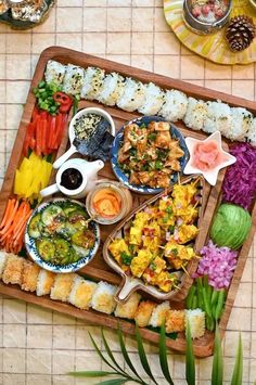 a wooden tray filled with different types of food