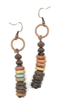 Aqua terra stones are complemented by wood beads and metal accents. Perfect with the matching necklace. Entire length is approximately 2.5" Check out the matching bracelet and necklace. Ready to ship in 2-5 business days