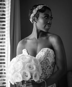 a woman in a wedding dress holding a bouquet