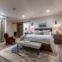 a large bed sitting in the middle of a bedroom