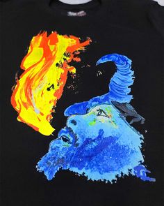 a black shirt with blue and yellow flames on it