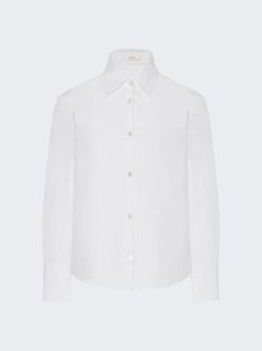 "Find THE ROW Frou Shirt on Editorialist. Petite button-up Cotton poplin Classic shirt hem French placket with mother-of-pearl buttons Dimensions: Model is 5'9\"/175cm and is wearing a size US4 Composition: 96% Cotton, 4% Elastane Care: Care according to label" Classic Blouse With Spread Collar And Covered Buttons, Daywear Blouse With Fold Down Collar And Buttons, Daywear Blouse With Buttons And Fold Down Collar, Luxury Spring Shirt With Button Closure, Classic Blouse With Collar And Concealed Placket, Tailored Button-up Shirt, Luxury Collared Shirt With Button Cuffs, Luxury Button-up Tops With Details, Luxury Spread Collar Shirt For Daywear