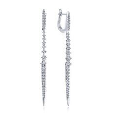 These linear drop earrings pack a major style punch into their slim silhouette. Segmented into sections of smooth tapered pave diamonds and prong set stones with a scalloped profile, they feature .95cts of scintillating diamonds in total. Constructed in luxe 14k white gold, these latch back earrings are a style savior. 14k White Gold Linear Diamond Drop Earrings | EG13633W45JJ Engagement Rings | Fashion Jewelry | Gabriel NY #diamondearrings #gabrielny #gabrielandco #fashionjewelry Earrings Pack, Lagos Jewelry, Rings Fashion, Diamond Drop Earrings, Designer Jewelry, Pave Diamonds, Shop Earrings, Prong Setting, Fashion Rings