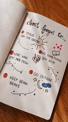 an open notebook with doodles on it that says don't forget to focus on the good