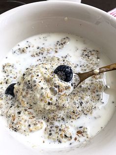 a white bowl filled with yogurt and granola