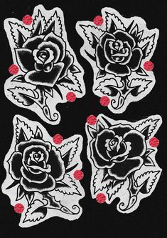 four black and white roses with red dots