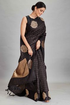 The charm of this black silk Banarasi saree is sure to leave everyone awestruck! It is enhanced with zari motifs border and comes with a yellow blouse piece. Disclaimer: The shown stitched blouse on the model is for display purpose only. The saree comes with a matching blouse piece and finished with fall and piko. DISCLAIMER: The actual product may vary slightly from the image. These are custom orders, hence expect slight variation in color and placement of the motif or buta. ESTIMATED DELIVERY: Black Art Silk Pre-draped Saree With Zari Weaving, Black Bollywood Handloom Pre-draped Saree, Bollywood Style Black Cotton Silk Pre-draped Saree, Black Kanjivaram Saree Silk, Black Cotton Silk Pre-draped Saree For Diwali, Black Handloom Pre-draped Saree For Festivals, Black Tussar Silk Traditional Wear For Designer Occasions, Black Katan Silk Dupatta With Motifs, Black Raw Silk Saree With Zari Work