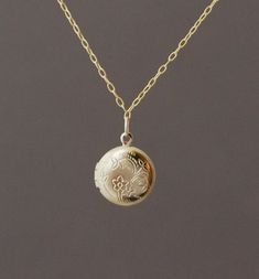 Cute gold locket hangs on a 16 inch 14k gold fill chain. It does open up so a little picture can be placed inside. Locket measures 1/2 of in inch in width. Locket is made out of a gold overlay. With care, the locket will not change colors. Item comes packaged in a jewelry box. Round Locket Necklace, Gold Locket Necklace, Round Locket, Gold Locket, Dope Jewelry, Jewelry Lookbook, Jan 11, Studio City, Necklace Dainty