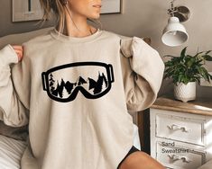 Aesthetic Ski Sweatshirt, Apres Ski Shirt, Women's Skiing Shirt, Ski Gifts For Her, Ski Graphic Tshirt, Trendy Gifts For Skiing, A5172 WELCOME TO LITTLE PREPPY TEE.... If you are looking for soft, comfortable, first-class clothes that you can design for your most special days or your loved ones, you are at the right place! We love what we do here at Best Creative Designs and we strive to make your shopping experience just right for you. If you have any questions about our products, feel free to Trendy Graphic Print Sweatshirt For Outdoor, Trendy Outdoor Graphic Print Sweatshirt, Trendy Outdoor Sweatshirt With Graphic Print, Trendy Crew Neck Sweatshirt For Outdoor, Casual Winter Skiing Tops, Winter Casual T-shirt For Outdoor Activities, Casual Graphic Print Tops For Winter Sports, White Crew Neck Top For Snowboarding, Casual Winter T-shirt For Outdoor Activities