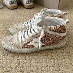 These Mid Star Sneakers Feature A Blend Of Pink-Gold Glitter And Suede On The Upper And A White Leather Flash That Perfectly Matches The Ggdb Star. Like New Condition No Box Poshmark Verifies Items Over $500 Shoes Golden Goose, Goose Shoes, Golden Goose Shoes, Star Sneakers, Golden Goose, Pink Gold, Gold Glitter, Womens Shoes Sneakers, White Leather