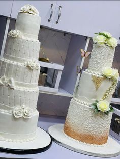 three tiered wedding cakes sitting on top of each other