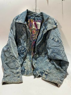 In great used vintage condition, with normal expected wear! On back under Indian design there are a few stains! I could NOT get zipper to work! Inside cuffs have some tearing! This blue jean button up collared Indian back designed aztec designed inside dual side pocketed jacket is a women's size medium! Bust size = 29". Smoke free owner! Please pay attention to the pictures to make sure this is the item(s) you are needing/wanting! The Picture is only to show the condition of  items I have. They Retro Long Sleeve Denim Jacket With Patchwork, Vintage Multicolor Denim Outerwear, Retro Patchwork Denim Jacket, Vintage Denim Patchwork Outerwear, Jacket Puffer, Vintage Pre-washed Denim Blue Outerwear, Aztec Designs, Jeans Button, Pocket Jacket