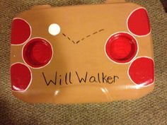 a brown and red sign that says will walker on it's side with circles