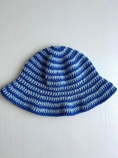 A handmade crochet striped bucket hat made with 100% cotton yarn! The hat has dark blue and light blue stripes and a ruffled brim. This is a medium size hat but is stretchy and can fit larger sizes. This hat is perfect to add to outfits and for gifting! It was made by me, so please message me with any questions! Unstretched Circumference: 20" Pattern *adapted*: Yarndrasil Bucket Hat Crochet Pattern, Striped Bucket Hat, Bucket Hat Crochet, Hat Crochet Pattern, Hat Crochet, Lancaster Pa, Crochet Hat Pattern, Bucket Hats, Hat Making