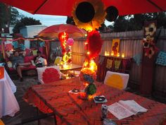 a table with an umbrella and some decorations on it