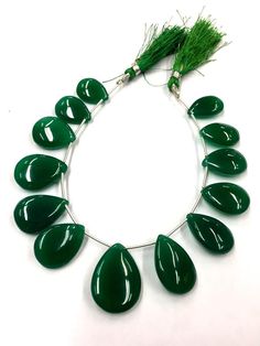 GEMSTONE  - GREEN ONYXSHAPE           - PEARSIZE               - 14-15 MM COLOR         -  GREEN BEAUTIFUL STRAND 100% NATURALWHOLESALE SHOPIf you have any questions about this item please contact me I will get back to you as soon as.We accept bulk or wholesale orders for any gemstone which you'll get best wholesale prices! Hence you can contact me with your requirement of bulk or wholesale order. I’ll be happy to fulfill your order. Green Polished Beads For Jewelry Making, Green Briolette Gemstones For Jewelry Making, Ruby Beads, Teardrop Beads, Blue Apatite, Sapphire Necklace, Ruby Gemstone, Green Onyx, Welo Opal