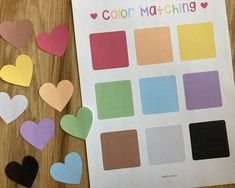 the color matching sheet is next to some cut out hearts