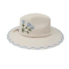 a white hat with blue flowers on it