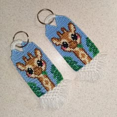 two beaded keychains with deers on them