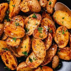 cooked potatoes with parmesan cheese and herbs