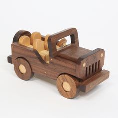 a wooden toy truck with wood wheels