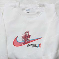 Zero Two x Swoosh Anime Embroidered Sweatshirt, Nike Inspired Embroidered Shirt, Custom Embroidered T-shirt In the bustling landscape of fashion, Tinicloset emerges as an oasis of creativity and style, where each garment tells a story and every stitch is a testament to artistry and craftsmanship. With an unwavering dedication to quality and a passion for... Casual Streetwear Tops With Machine Embroidery, Casual Tops With Machine Embroidery For Streetwear, Casual Machine Embroidered Tops For Streetwear, White Sweatshirt With Machine Embroidery For Streetwear, Sporty Embroidered Crew Neck T-shirt, Long Sleeve Tops With Machine Embroidery For Streetwear, Custom Embroidered Tops For Streetwear, Custom Embroidered Cotton Tops For Streetwear, Sporty Custom Embroidered Tops For Streetwear