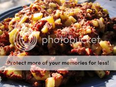 a blue plate topped with potatoes covered in meat and sauce next to a text overlay that reads protect more of your memories for less