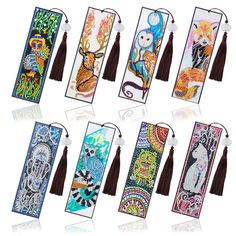 twelve bookmarks with tassels decorated with images of cats and other animals on them