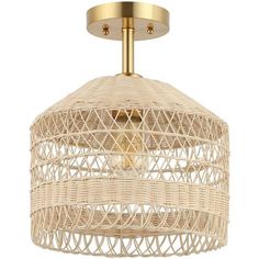 the light fixture is made out of wicker and has a gold metal frame, which matches