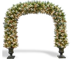 a christmas tree arch with lights on it