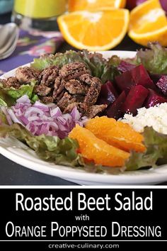 roasted beet salad with orange poppy seed dressing on a white plate next to sliced oranges