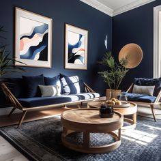 a living room filled with furniture and paintings on the wall next to a coffee table