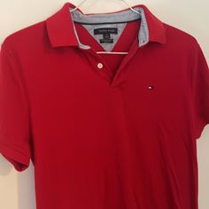 Size : M In Perfect Condition No Rips Stain Or Any Damage Red Polo With Logo On The Chest Area Pit To Pit 18" Classic Red Fitted T-shirt, Red Fitted Polo Collar T-shirt, Casual Red Top With Collar, Classic Fitted Red T-shirt, Fitted Tommy Hilfiger Polo Collar Top, Tommy Hilfiger Red Short Sleeve Top, Tommy Hilfiger Red Cotton Top, Red Cotton Tommy Hilfiger Tops, Tommy Hilfiger Red Cotton Shirt