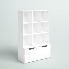 a white bookcase with four bins on the front and two drawers on the back