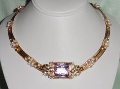 NATURAL UNTREATED 54CT SQUARE CKB SOFT PINK TOPAZ GEMSTONE, SWAROVSKI CRYSTALS, PEARLS, 14KT YELLOW GOLD OMEGA NECKLACE 18 1/2" I used a lot of 14kt yellow gold to design this necklace and used 4mm AB Clear, AB soft Rose Swarovski Crystals, and Pearls. The band is approximately 1/2" wide with a length is 18 1/2". I've created a hook and eye closure.  The necklace comes in a necklace case and an outer 2pc gift box. Pink Gemstone Accents Necklaces For Formal Occasions, Formal Pink Necklaces With Gemstone Accents, Formal Pink Gemstone Accented Necklaces, Rectangular Rose Gold Jewelry For Evening, Gold Jewelry With Gemstone Accents For Evening, Pink Gemstone Jewelry For Evening, Gold Rectangular Necklace For Evening, Rectangular Gold Necklace For Evening, High Luster Pink Jewelry For Anniversary