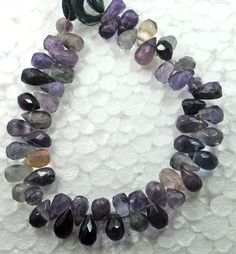 amethorate beads are arranged in a circle