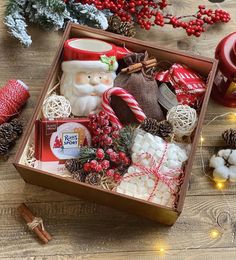 a wooden table topped with lots of christmas decorations