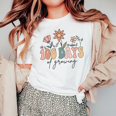 Celebrate your 100th day of school with this '100 Days of Growing' floral Teacher Shirt! Find more 100 days of school shirts and sweatshirts for your favorite teacher or student here. https://www.etsy.com/shop/JaxGraphicTees?search_query=100+days These t-shirts are Bella + Canvas 3001 Unisex shirts. They are a super soft fabric that will quickly become a go to in your wardrobe. Its lightweight and flexible material is perfect for casual wear or any activity. Sizing details: * All shirts are unis 100 Days Of School Sublimation, 100th Day Of School Shirts For Teachers, 100th Day Of School Shirts, 100days Of School Shirt, Christian Crewneck, 100 Days Of School Shirt, Scripture Shirt, Boho Christian, Gender Reveal Shirts