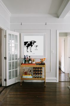 a bar cart in the middle of a living room